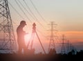 Silhouette engineer looking Loaders and trucks in a building sit