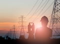 Silhouette engineer looking Loaders and trucks in a building sit Royalty Free Stock Photo