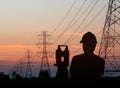 Silhouette engineer looking Loaders and trucks in a building sit Royalty Free Stock Photo