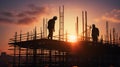 Silhouette of Engineer and worker on building site, construction site at sunset in evening time Royalty Free Stock Photo