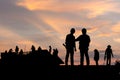 Silhouette of Engineer and worker on building site, construction site at sunset in evening time Royalty Free Stock Photo