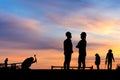 Silhouette of Engineer and worker on building site, construction site at sunset in evening time Royalty Free Stock Photo