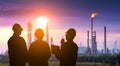 Silhouette of engineering team working at refinery plant