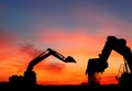 Silhouette of Excavator loader at construction site Royalty Free Stock Photo