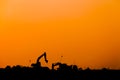 Silhouette of excavator loader at construction site,Silhouette Backhoe Royalty Free Stock Photo