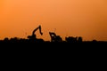 Silhouette of excavator loader at construction site,Silhouette Backhoe Royalty Free Stock Photo