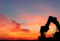 Silhouette of Excavator loader at construction site Royalty Free Stock Photo