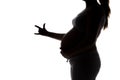 Silhouette of expectant mother showing fingers Royalty Free Stock Photo