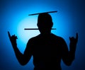 Silhouette Expressive young drummer with drum stick on a blue background Royalty Free Stock Photo