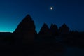 Silhouette of Fairy Chimneys or Peri Bacalari and Moon at Sunrise
