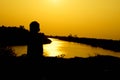 Silhouette of a family comprising a father, mother and two children happy family the sunset.Concept of friendly Royalty Free Stock Photo