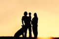 Silhouette of Family with Dog and Pregnant Mother at Sunset Royalty Free Stock Photo