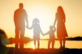 Silhouette family, including his father, mother and two children in the hands of Royalty Free Stock Photo