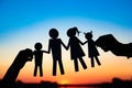 Silhouette family, including his father, mother and two children in the hands of Royalty Free Stock Photo