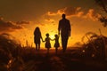 Silhouette of family on sunset background. Happy family concept, Silhouette of young couple hiker were standing at the top of the Royalty Free Stock Photo