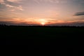 Silhouette fantastic sunset at the field. dramatic picturesque scene. majestic rural landscape. nature background Royalty Free Stock Photo