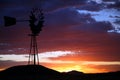 Silhouette of Farm Windmill at Sunset Royalty Free Stock Photo