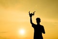 Silhouette of farmer using drone remote control Royalty Free Stock Photo