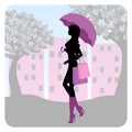 Silhouette of fashionable girl walking down the street with an umbrella in his hand Royalty Free Stock Photo