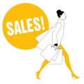 Silhouette of fashionable woman with shopping bags walking on the stree Royalty Free Stock Photo