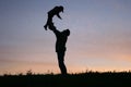 Silhouette father with child