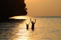 Silhouette Father and daughter enjoy swimming and snorkeling near the beach with sunset Royalty Free Stock Photo