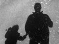 Silhouette of father and daughter