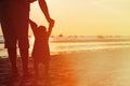 Silhouette of father and little daughter at sunset Royalty Free Stock Photo