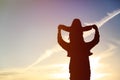 Silhouette of father and little daughter at sunset Royalty Free Stock Photo