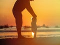 Silhouette of father and little daughter walk at sunset Royalty Free Stock Photo