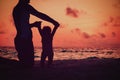 Silhouette of father and little daughter walk at sunset Royalty Free Stock Photo