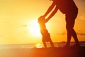 Silhouette of father and little daughter walking Royalty Free Stock Photo