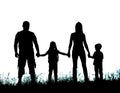 Silhouette father, mother and kids holding hands