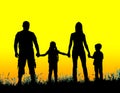 silhouette father, mother and kids holding hands at sunset Royalty Free Stock Photo