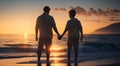 silhouette of father and son holding hands, standing on the beach at sunset. family on vacation Royalty Free Stock Photo