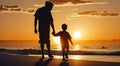 silhouette of father and son holding hands at sunset walking on beach Royalty Free Stock Photo