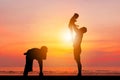 Silhouette of Father and two kids having fun on sunset, Happy family concept Royalty Free Stock Photo