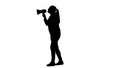 Silhouette of a female activist isolated on a white alpha channel. Female activist speaking and protesting with a