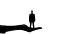 Silhouette of female hand holding man, womens authority, dominance manipulation Royalty Free Stock Photo