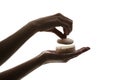 Silhouette of female hands holding face powder on white background Royalty Free Stock Photo