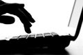 Silhouette of a female hands typing on the keyboard Royalty Free Stock Photo