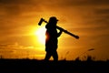 Silhouette of female photographer walking outdoors Royalty Free Stock Photo