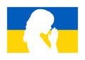 Silhouette of female praying on Ukraine flag