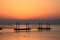 Silhouette of female tourist watching the sunrise over the Sea of Galilee Royalty Free Stock Photo