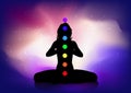 Silhouette of female in yoga pose with chakras Royalty Free Stock Photo