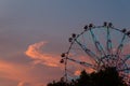 Silhouette of ferris wheel at sunset at county fair. Royalty Free Stock Photo