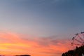 Silhouette of ferris wheel at sunset at county fair. Royalty Free Stock Photo