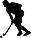 Silhouette of field hockey player with a hockey stick Royalty Free Stock Photo