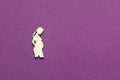 Silhouette of a figure of a pregnant woman on a purple