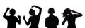 Silhouette of figures of a couple of teenagers in headphones listening to music, the guy and the girl are dancing with hands up, Royalty Free Stock Photo